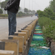 Illustration for article titled Mysterious Rainbow River of Pills Appears In China